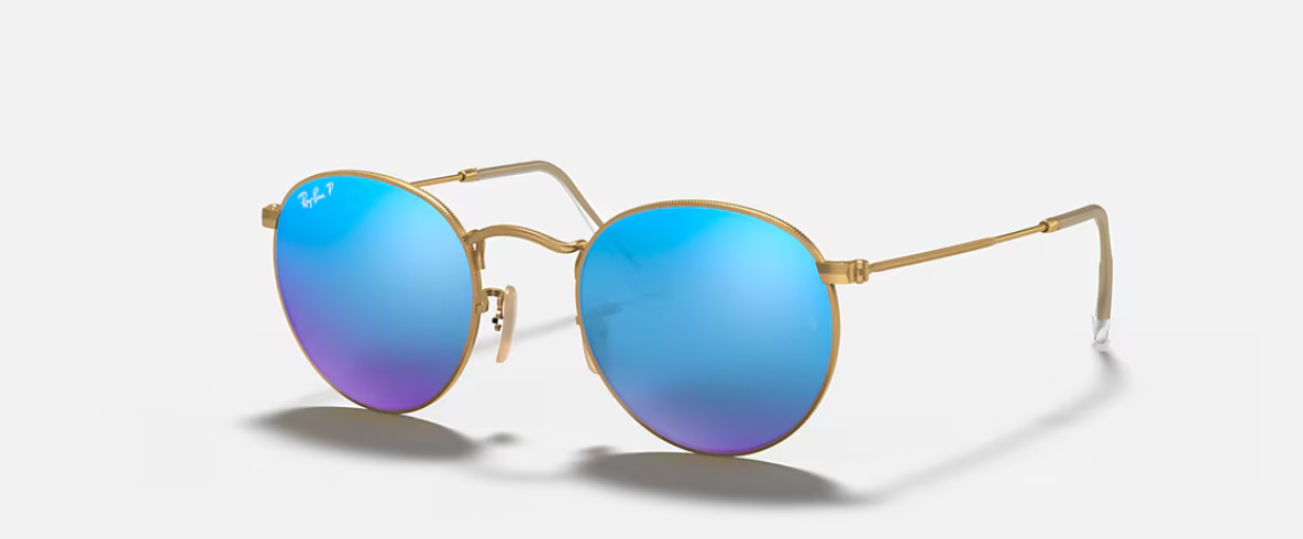 lente dorado con vidrio azules